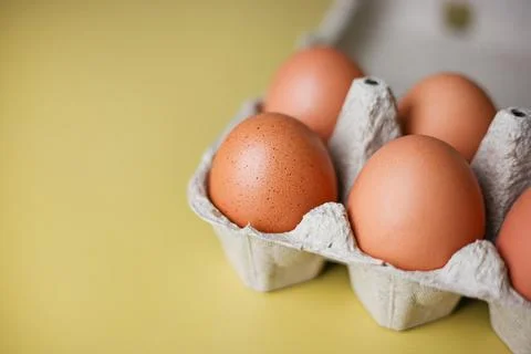 Brown eggs in eco packaging made from recycled materials Stock Photos