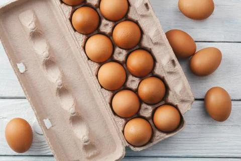 Brown eggs in egg box Stock Photos