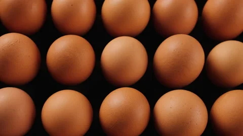 Brown eggs filling platform in egg production facility - camera slide. Stock Footage 172457336