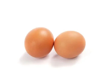 Brown eggs isolated on a white background. Stock Photos