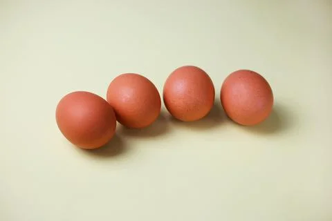 Brown eggs on a light isolated background for copyspace, text Stock Photos