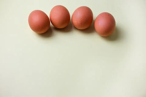 Brown eggs on a light isolated background for copyspace, text Stock Photos