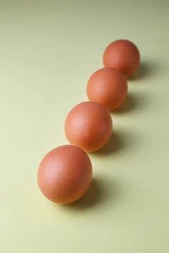 Brown eggs on a light isolated background for copyspace, text Stock Photos