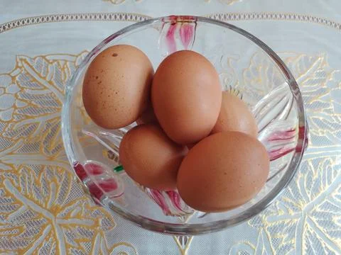 Brown Eggs in a Pot at table Stock Photos