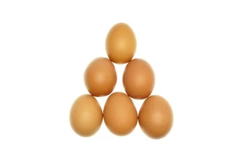 Brown eggs put as triangle isolated Foto stock
