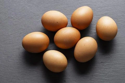 Brown Eggs on Slate Surface Kitchen Ingredient Stock Photos