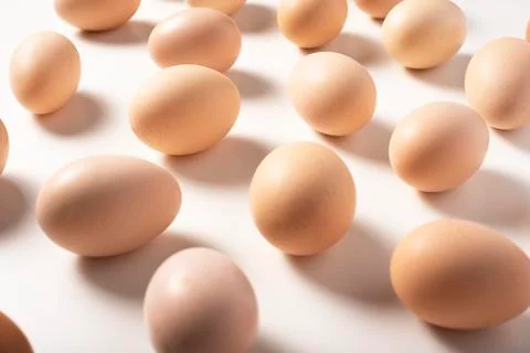 Brown eggs on white background. Stock Photos