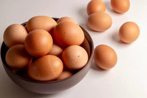 Brown eggs on white background Stock Photos