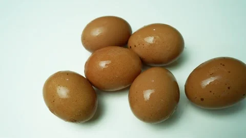 Brown Eggs on White Background, Six brown eggs on a white background, arran.. Stock Footage 305045058