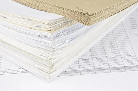 Brown envelope and overload of old paperwork Stock Photos