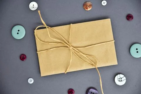 Brown envelope on a gray background. Stock Photos
