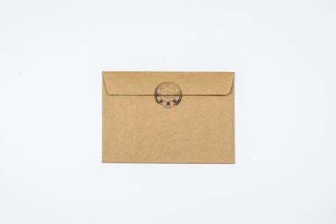 A brown envelope with a stamp. Stock Photos