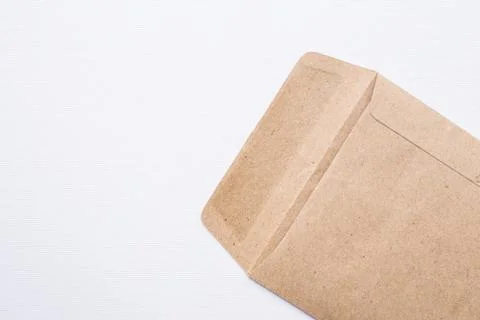 Brown envelope on white canvas background Stock Photos