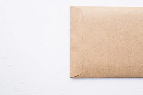 Brown envelope on white canvas background Stock Photos