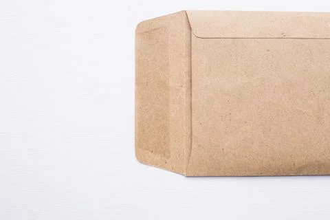 Brown envelope on white canvas background Stock Photos