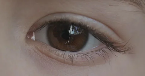 Brown Eye of Child Looking at Camera Close Up. Macro Shot Opening and Closi.. Stock Footage 318459767