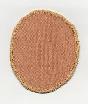 Brown fabric patch An oval yellow brown fabric patch texture Copyright: xZ... Stock Photos