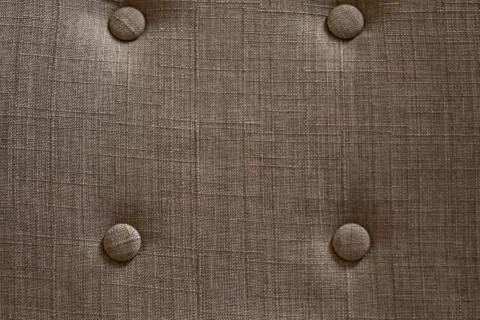 Brown fabric structure with four knobs on a chair 写真素材