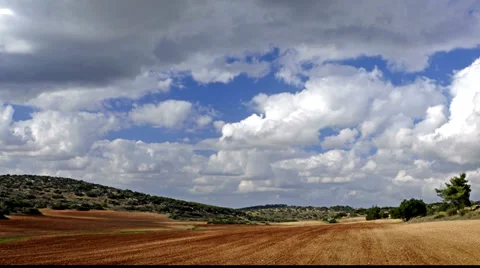 Brown fields with blue sky and clouds, time lapse, Israel Stock-Footage 36791315