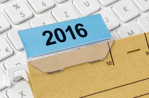 A brown file folder labeled with 2016 Stock Photos