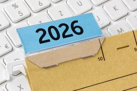 A brown file folder labeled with 2026 Stock Photos