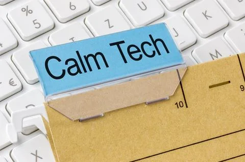 A brown file folder labeled with Calm Tech Photos