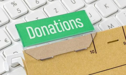 A brown file folder labeled Donations A brown file folder labeled Donation... Stock-Fotos