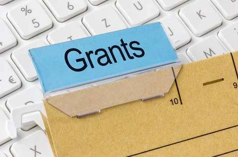 A brown file folder labeled with Grants A brown file folder labeled with G... Stock Photos