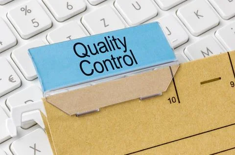 A brown file folder labeled with Quality Control Stock Photos