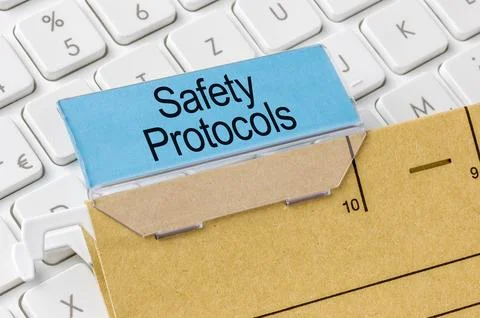 A brown file folder labeled with Safety Protocols Stock Photos