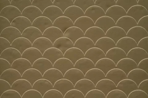 Brown fish scale seamless pattern on decorated cement wall Stock Photos