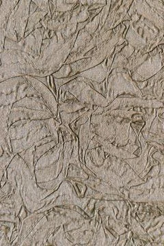 Brown floral embossed batik pattern. Floral pattern. Leaf stamped texture Stock Photos