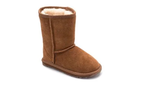Brown fluffy ugg boot style childrens footwear on white background Stock Photos