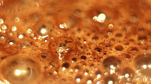 Brown foam with large bubbles on the surface of hot cocoa close-up. Stock Footage 205914431