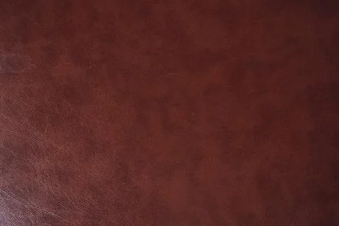 Brown genuine leather with a pattern of designer lines. A template for your Stock Photos