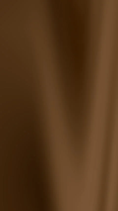 Brown gradient fabric drapes creating subtle folds and shadows. Video stock 298985126