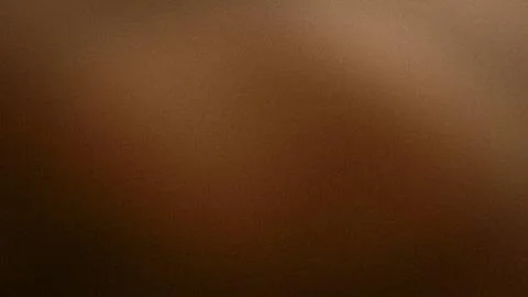 Brown grainy abstract background with warm beige and dark brown gradient in.. Stock Photos