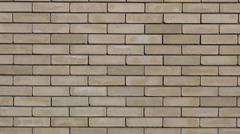 Brown-gray brick wall with empty copy space Stock Photos