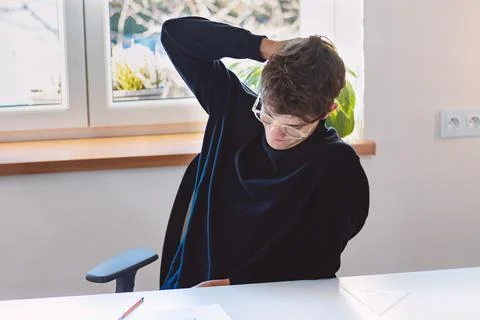 Brown-haired architect is thinking hard about a new design for a new prototyp Stock Photos