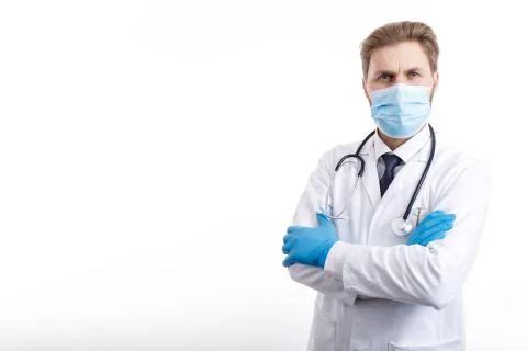 Brown-haired Physician in Mask Posing With Arms Crossed Stock Photos
