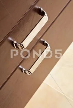 Brown hardwood drawers with metal handle Stock Photos