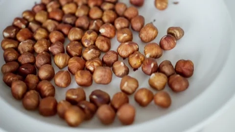 Brown hazelnuts, pile of peeled nuts. Top view of hazel kernels close up Stock Footage 302658050