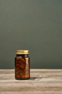Brown jar on the table full of pills Stock Photos