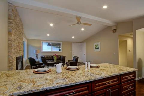Brown kitchen design with breakfast bar. Stock Photos