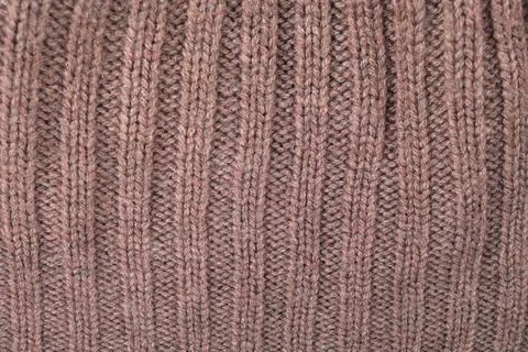 Brown knitted wool fabric texture. Soft sweater surface with rib pattern. Clo 写真素材