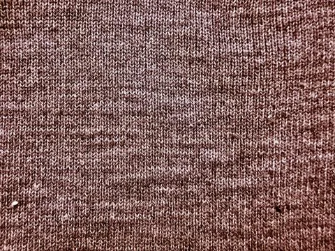 Brown knitted wool macro texture closeup fabric cozy warm stitch detail 写真素材