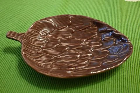 Brown leaf-shaped ceramic serving dish Stock Photos