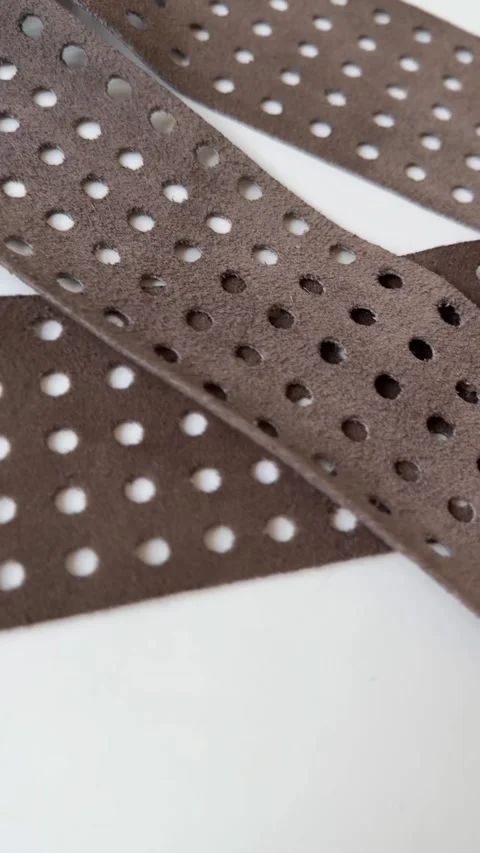 Brown leather belt with rectangular brass buckle on white background Stock Footage 321292888