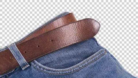 A brown leather belt is threaded through the waistline of blue denim jeans, Stock Photos