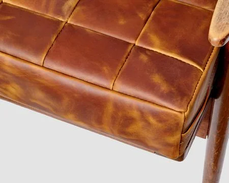 Brown leather patchwork seat cushion on vintage wooden chair Photos